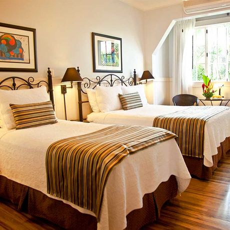 Boutique-Hotel Grano de Oro Familiensuite 01 Zwei Betten der Familiensuite im Boutique-Hotel Grano de Oro