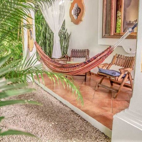 Ferienhaus Villas Kalimba Ferienhaus Kalimba 03 Blick auf eine Hängematte in einem Ferienhaus der Villas Kalimba