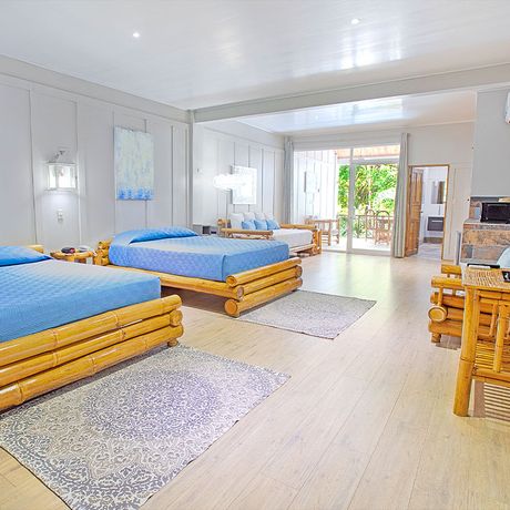 Blick auf zwei Doppelbetten in einer Suite des Boutique-Hotels Plaza Yara